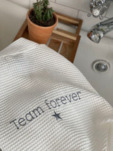 Load image into Gallery viewer, close-up-white-waffle-dressing-gown-with-team-forever-embroidered-grey
