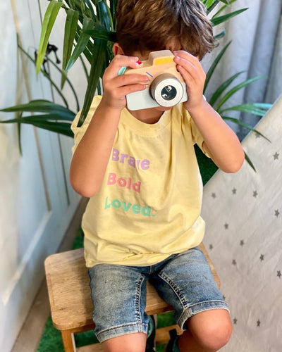 kids-affirmation-tee-kids-brave-yellow-wooden-toy-camerat-shirt