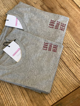 Load image into Gallery viewer, grey-marl-tshirts-folded-love-grows-here-maroon-slogan
