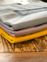 Load image into Gallery viewer, stack-coloured-tshirts-love-is-love-slogan
