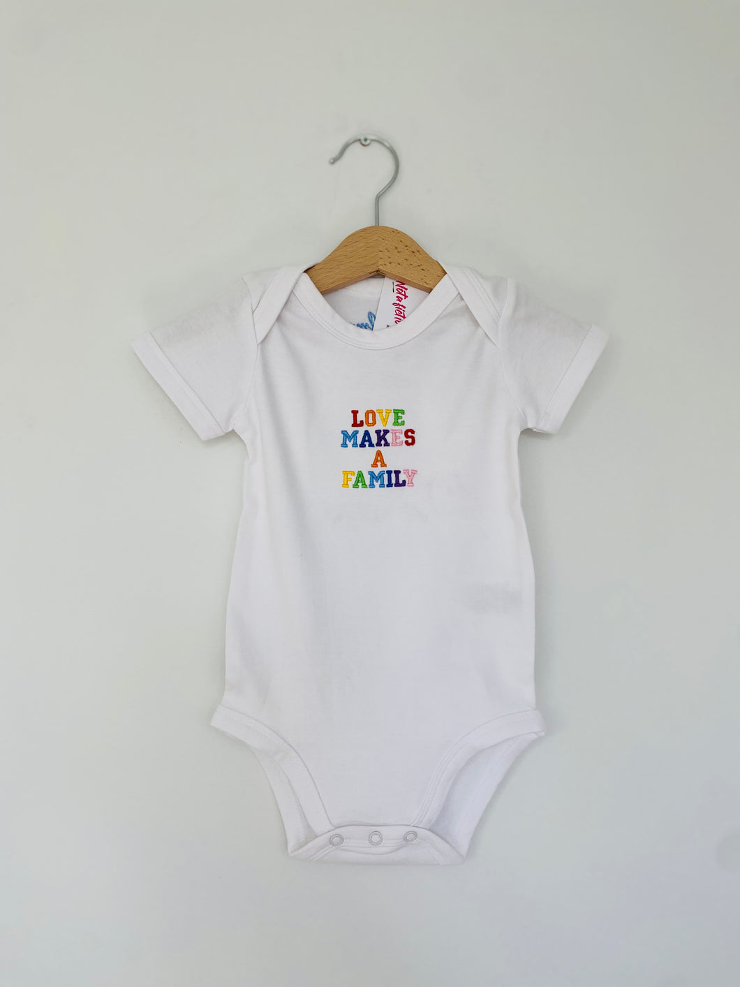 love-makes-a-family-adoption-babygrow-lgbtq-babygrow-pride-babygrow