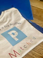Load image into Gallery viewer, Officially a big brother/sister matched T-shirt with matching graduation cap
