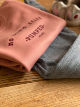 Load image into Gallery viewer, pink- no-bump-still-pumped-club-sweat-folded-with-jeans
