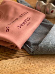 pink- no-bump-still-pumped-club-sweat-folded-with-jeans